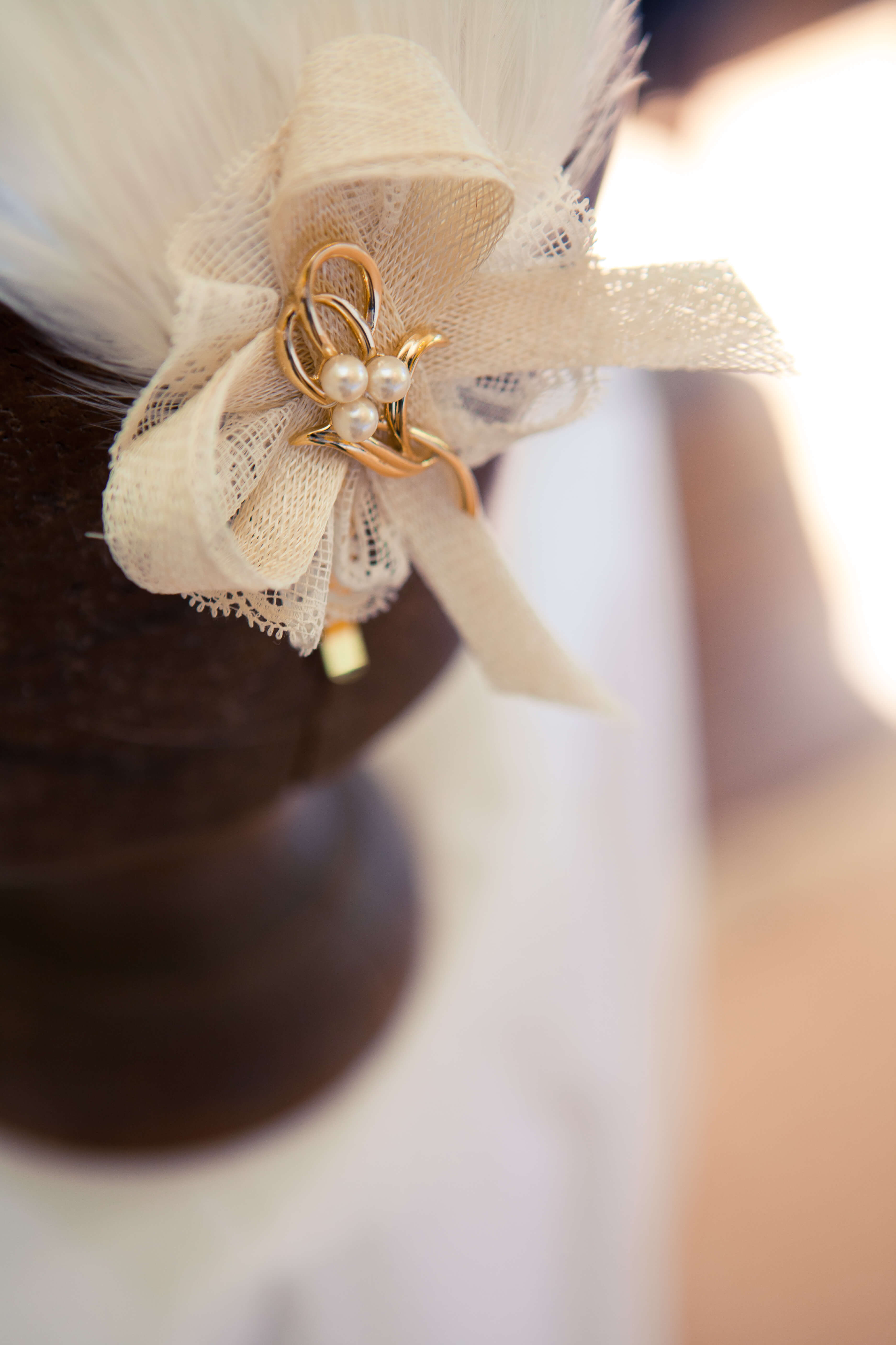 Bespoke hat with a cream bow.