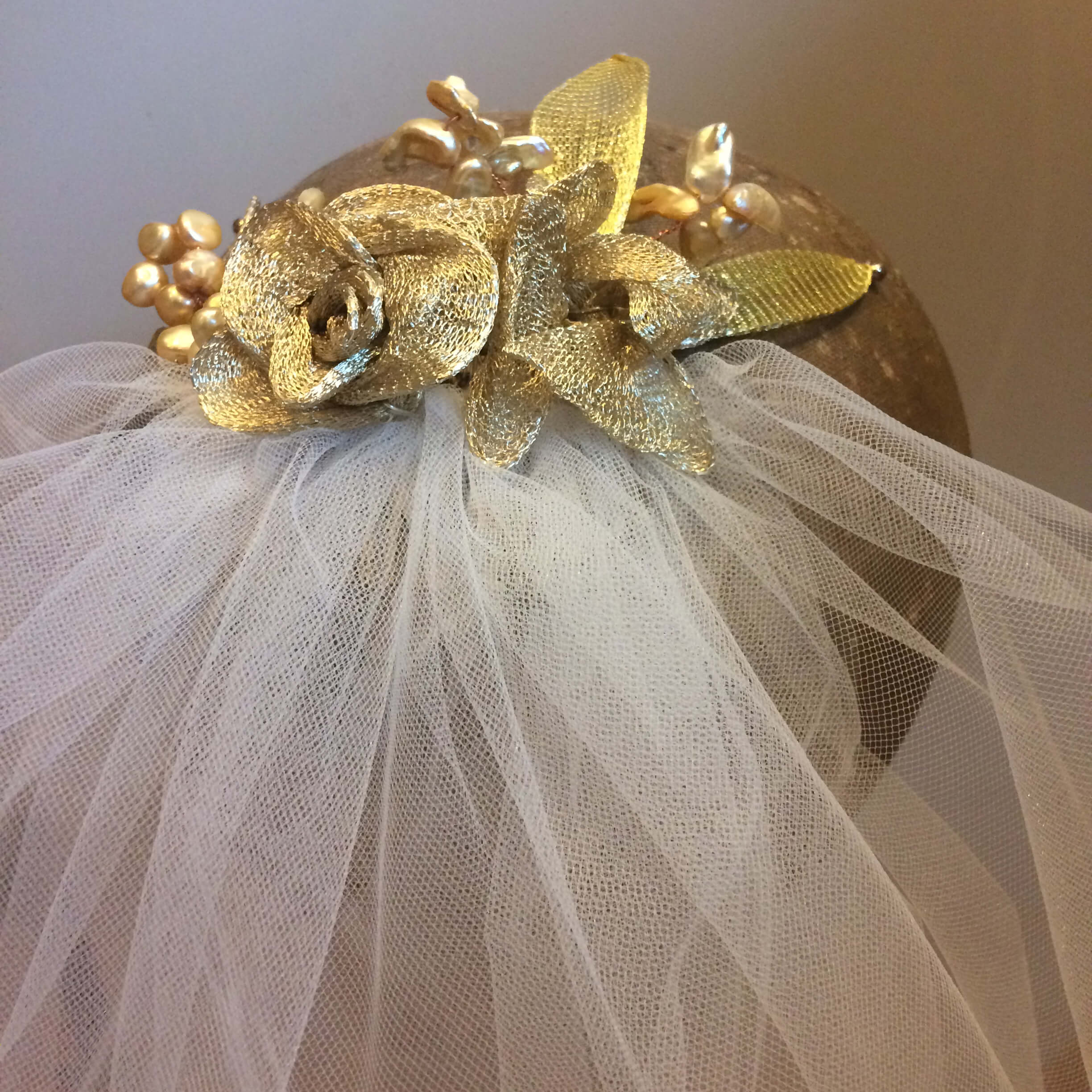 Veil with gold detailing.